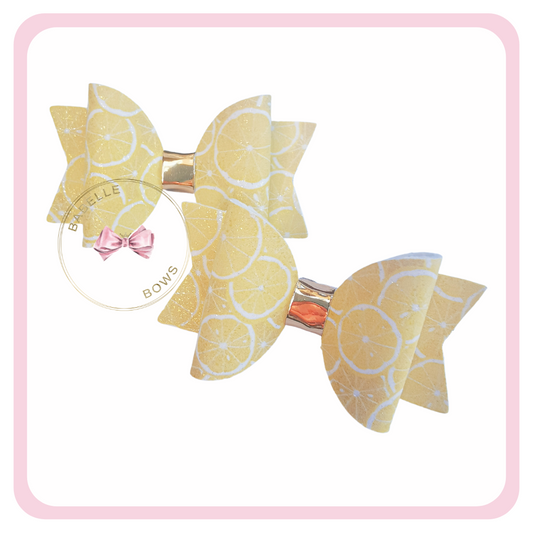 Sour Lemon's hair bows are the perfect accessory for your little ones hair this summer. These lemon hair bows are too cute – and only £5.50!